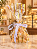 Grab-and-go mini pistachio biscotti in a clear gift bag with La Roma Bakery ribbon